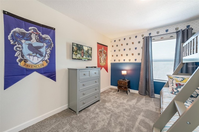 bedroom with carpet floors, baseboards, and wallpapered walls
