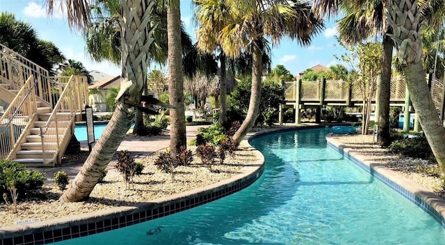 community pool featuring stairs