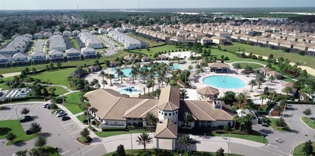 birds eye view of property with a residential view