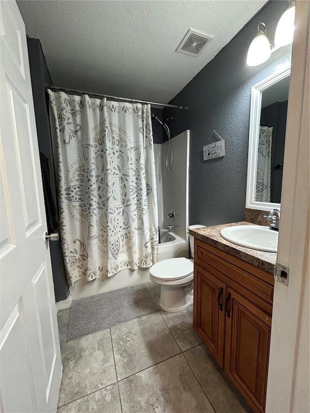 bathroom featuring vanity, toilet, a textured ceiling, shower / tub combo, and visible vents