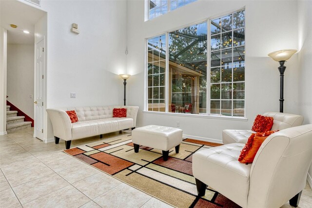 14003 Hampshire Bay Cir, Winter Garden, FL 34787 - tiled living area with baseboards and stairs