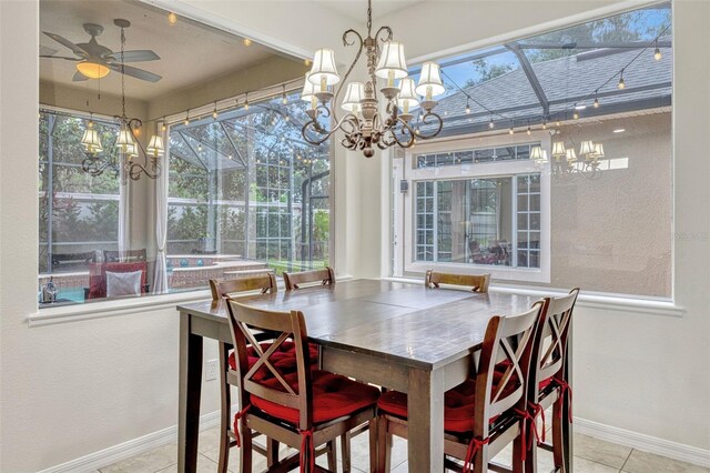 14003 Hampshire Bay Cir, Winter Garden, FL 34787 - dining space with baseboards, tile patterned flooring, and ceiling fan with notable chandelier