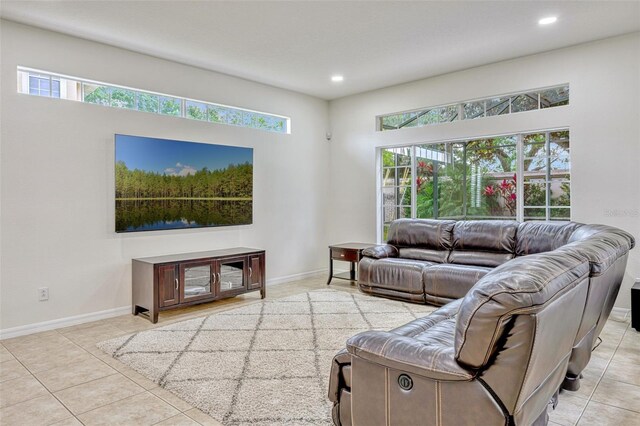 14003 Hampshire Bay Cir, Winter Garden, FL 34787 - tiled living area with baseboards, recessed lighting, and a wealth of natural light