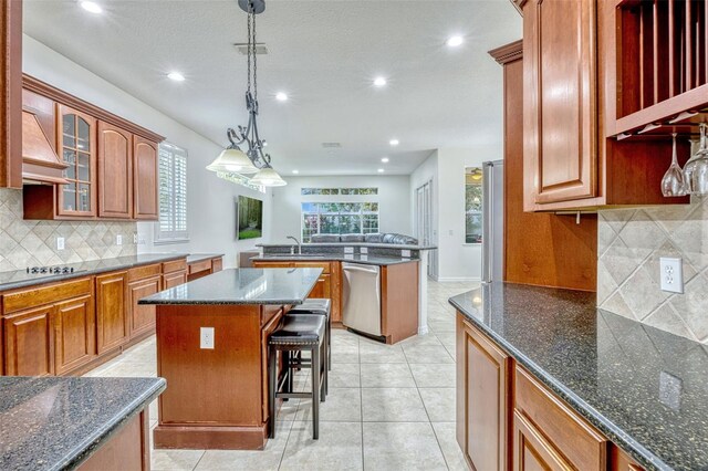 14003 Hampshire Bay Cir, Winter Garden, FL 34787 - kitchen with a center island, recessed lighting, dishwasher, and tasteful backsplash