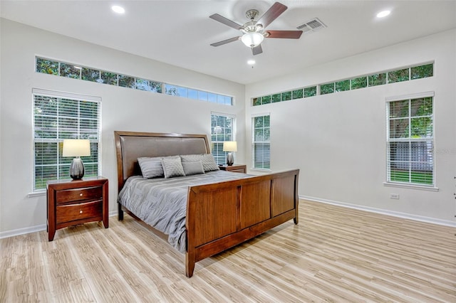 14003 Hampshire Bay Cir, Winter Garden, FL 34787 - bedroom featuring recessed lighting, baseboards, visible vents, and light wood-type flooring