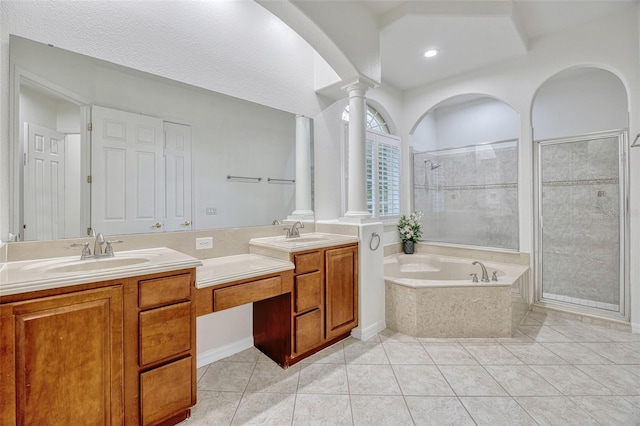 14003 Hampshire Bay Cir, Winter Garden, FL 34787 - bathroom with a sink, double vanity, ornate columns, a garden tub, and a stall shower