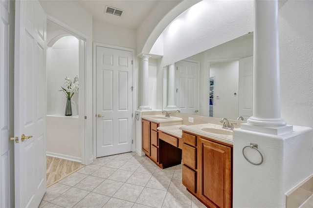 14003 Hampshire Bay Cir, Winter Garden, FL 34787 - bathroom with a sink, ornate columns, double vanity, and visible vents