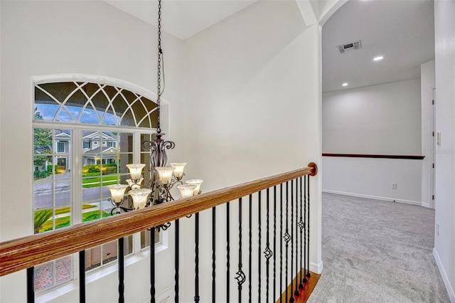 14003 Hampshire Bay Cir, Winter Garden, FL 34787 - hallway with visible vents, carpet flooring, baseboards, and a chandelier