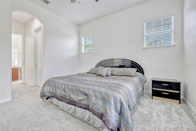 14003 Hampshire Bay Cir, Winter Garden, FL 34787 - bedroom with ceiling fan, visible vents, arched walkways, carpet floors, and baseboards