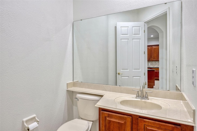 14003 Hampshire Bay Cir, Winter Garden, FL 34787 - bathroom with vanity, a textured wall, and toilet
