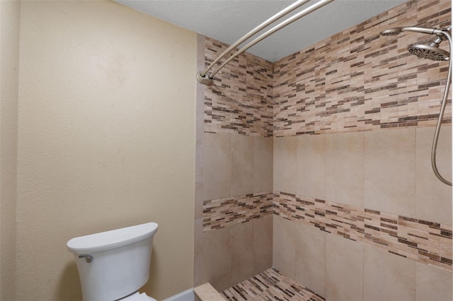 7449 Sugar Bend Dr Unit 7449, Orlando, FL 32819 - full bathroom with a tile shower and toilet