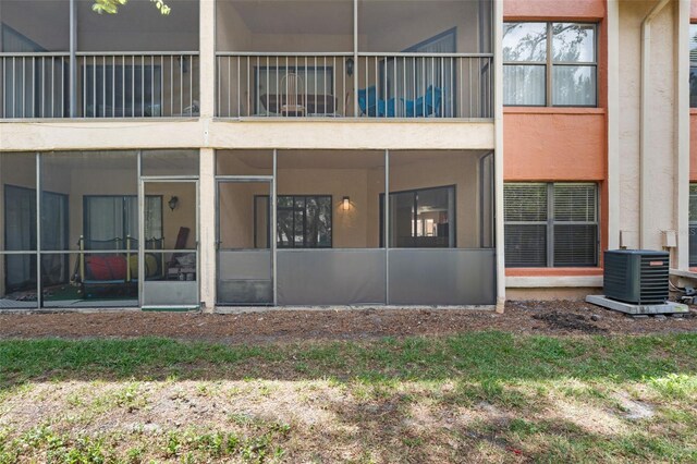 7449 Sugar Bend Dr Unit 7449, Orlando, FL 32819 - back of property with cooling unit and stucco siding
