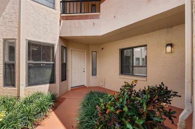 7449 Sugar Bend Dr Unit 7449, Orlando, FL 32819 - view of exterior entry with stucco siding