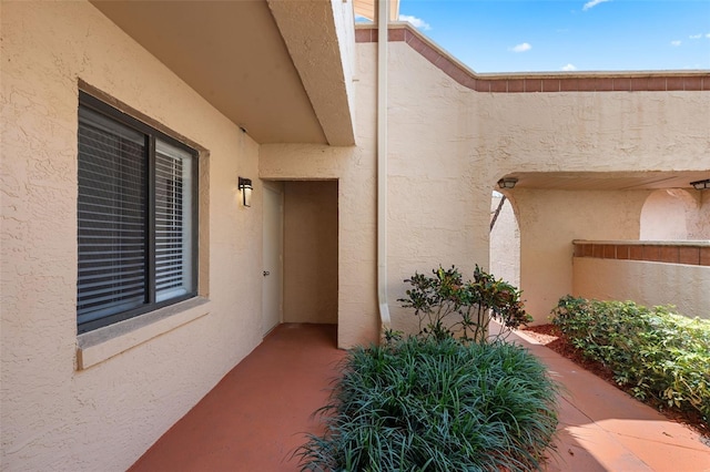 7449 Sugar Bend Dr Unit 7449, Orlando, FL 32819 - view of exterior entry with stucco siding