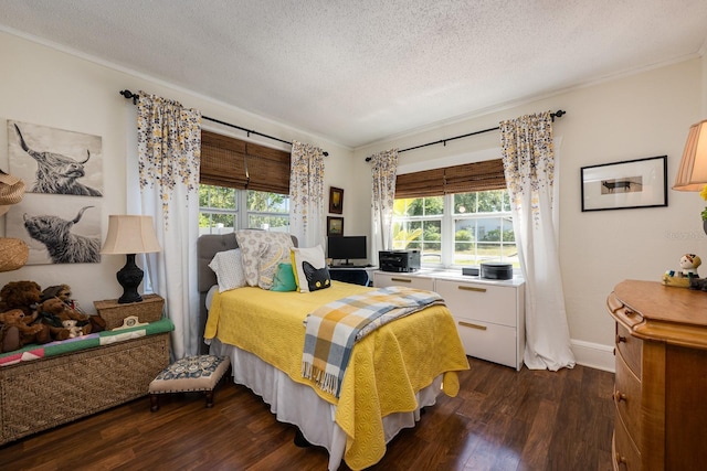 bedroom with crown molding, a textured ceiling, baseboards, and dark wood-style floors