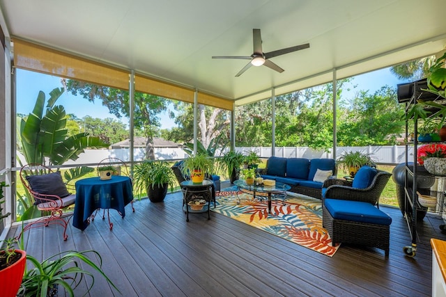 sunroom / solarium with an outdoor hangout area, a ceiling fan, and a healthy amount of sunlight