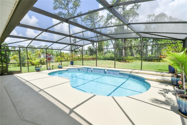 pool featuring a lawn, a patio, and a lanai