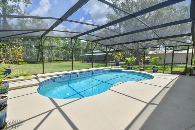 pool featuring a yard, a patio, and glass enclosure