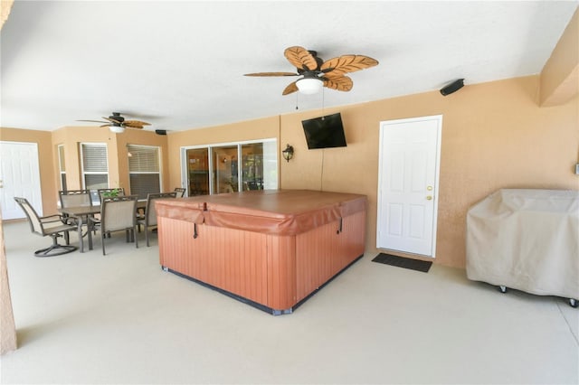 living area featuring ceiling fan and light carpet