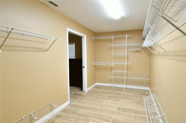 spacious closet with visible vents and light wood finished floors