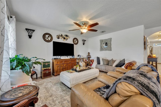 822 Sheen Cir, Haines City, FL 33844 - living room with visible vents, a ceiling fan, baseboards, and arched walkways