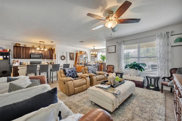 822 Sheen Cir, Haines City, FL 33844 - living room featuring a textured ceiling, light carpet, and ceiling fan with notable chandelier