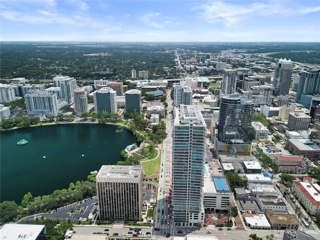 drone / aerial view with a city view and a water view