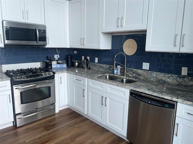 kitchen featuring white cabinetry, appliances with stainless steel finishes, and a sink