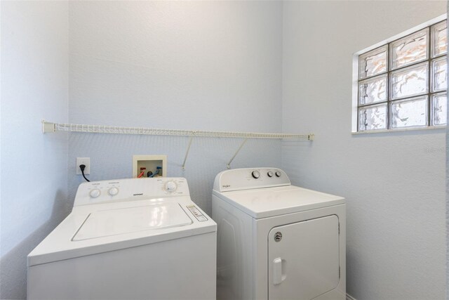 laundry area with washer and clothes dryer