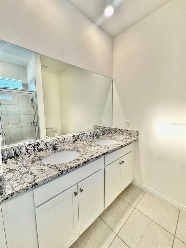7871 Penrose Pl, Wildwood, FL 34785 - bathroom with toilet, a sink, tile patterned flooring, and a stall shower