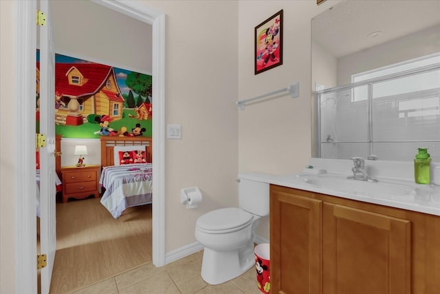 1031 Marcello Blvd, Kissimmee, FL 34746 - bathroom with connected bathroom, a shower with shower door, tile patterned flooring, vanity, and toilet
