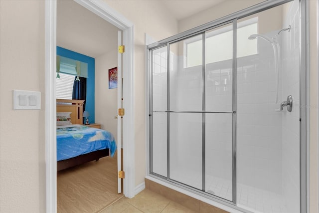 1031 Marcello Blvd, Kissimmee, FL 34746 - full bathroom featuring plenty of natural light, baseboards, and a stall shower