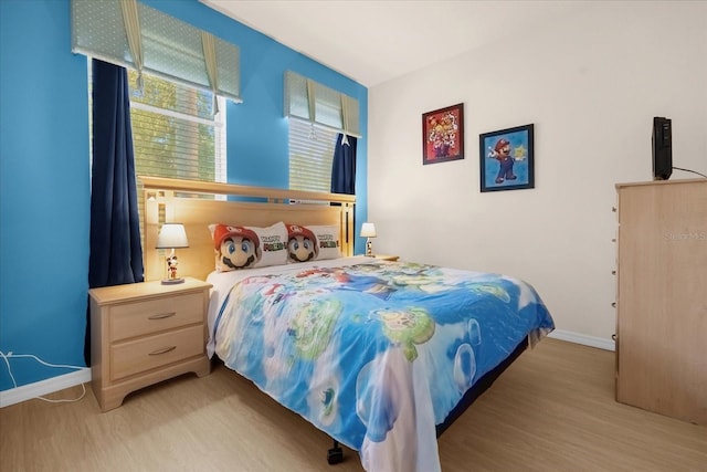 1031 Marcello Blvd, Kissimmee, FL 34746 - bedroom with baseboards and wood finished floors