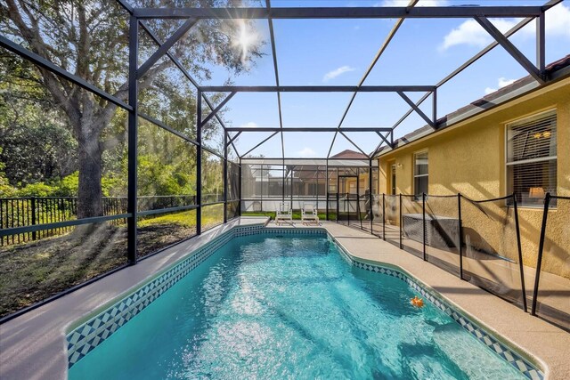 1031 Marcello Blvd, Kissimmee, FL 34746 - view of swimming pool with a patio, a fenced backyard, a lanai, and a fenced in pool