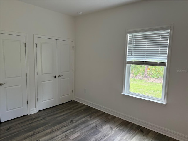 6179 Notre Dame Ter, North Port, FL 34291 - unfurnished bedroom featuring dark wood finished floors
