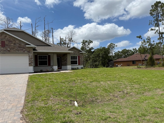 6179 Notre Dame Ter, North Port, FL 34291 - view of grassy yard featuring an attached garage and decorative driveway