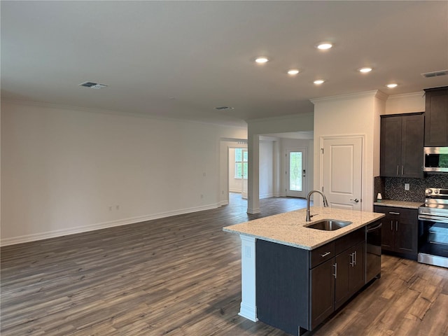 6179 Notre Dame Ter, North Port, FL 34291 - kitchen featuring stainless steel appliances, ornamental molding, dark wood-style floors, open floor plan, and backsplash