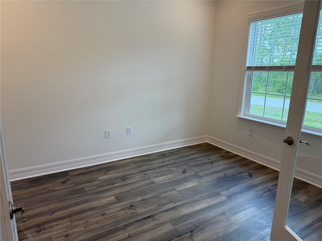 6179 Notre Dame Ter, North Port, FL 34291 - spare room featuring dark wood-style floors and baseboards