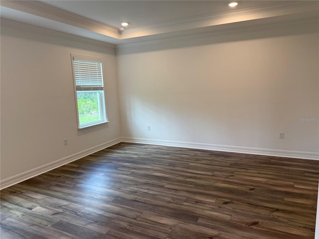 6179 Notre Dame Ter, North Port, FL 34291 - empty room with ornamental molding, dark wood finished floors, a tray ceiling, and recessed lighting