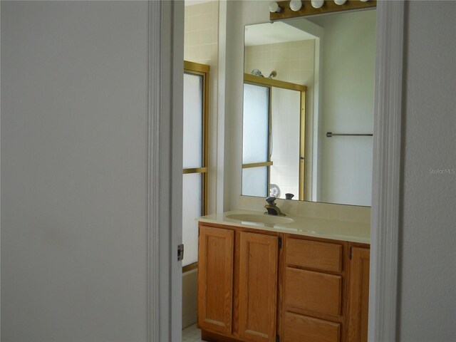 full bathroom featuring vanity and a shower