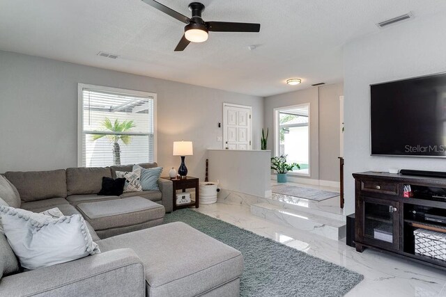 2803 Tech Dr, Orlando, FL 32817 - living area featuring visible vents, a ceiling fan, and marble finish floor