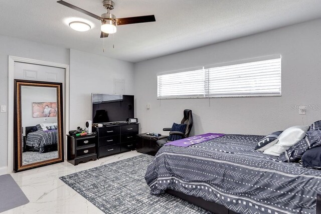 2803 Tech Dr, Orlando, FL 32817 - bedroom featuring a ceiling fan and marble finish floor
