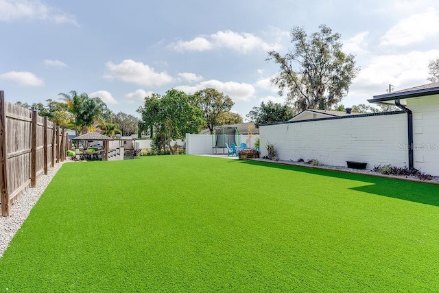 2803 Tech Dr, Orlando, FL 32817 - view of yard with a gazebo, a fenced backyard, and a trampoline