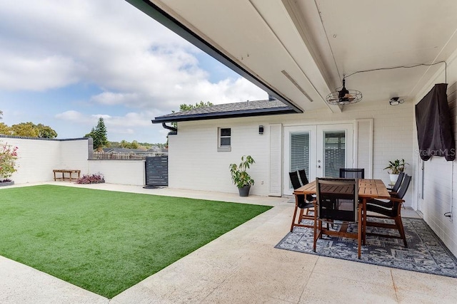 2803 Tech Dr, Orlando, FL 32817 - view of yard with french doors, fence, a patio, and outdoor dining area
