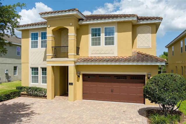 7519 Marker Ave, Kissimmee, FL 34747 - mediterranean / spanish-style house with stucco siding, a garage, and a tile roof