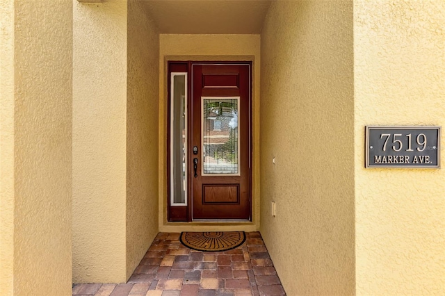 7519 Marker Ave, Kissimmee, FL 34747 - view of exterior entry with stucco siding