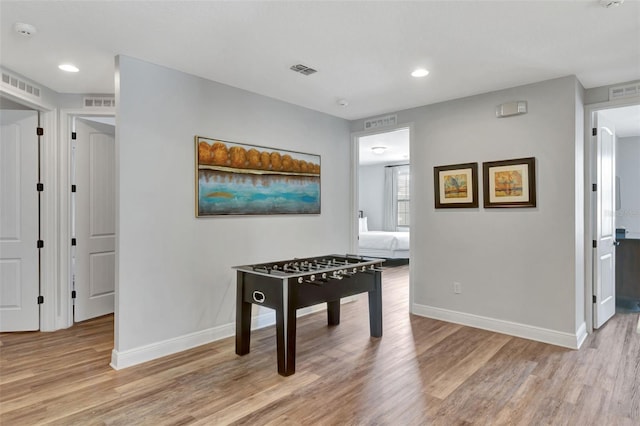 7519 Marker Ave, Kissimmee, FL 34747 - playroom with light wood finished floors, visible vents, and baseboards