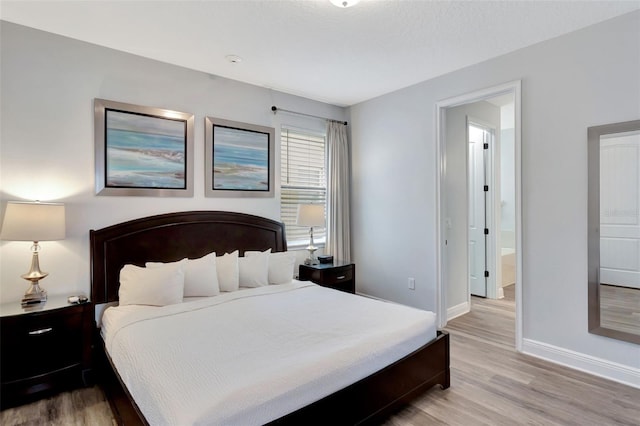 7519 Marker Ave, Kissimmee, FL 34747 - bedroom with light wood-type flooring and baseboards