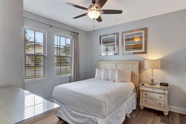 7519 Marker Ave, Kissimmee, FL 34747 - bedroom with dark wood finished floors, baseboards, and ceiling fan