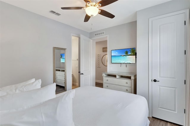 7519 Marker Ave, Kissimmee, FL 34747 - bedroom featuring a ceiling fan, visible vents, and dark wood-style floors
